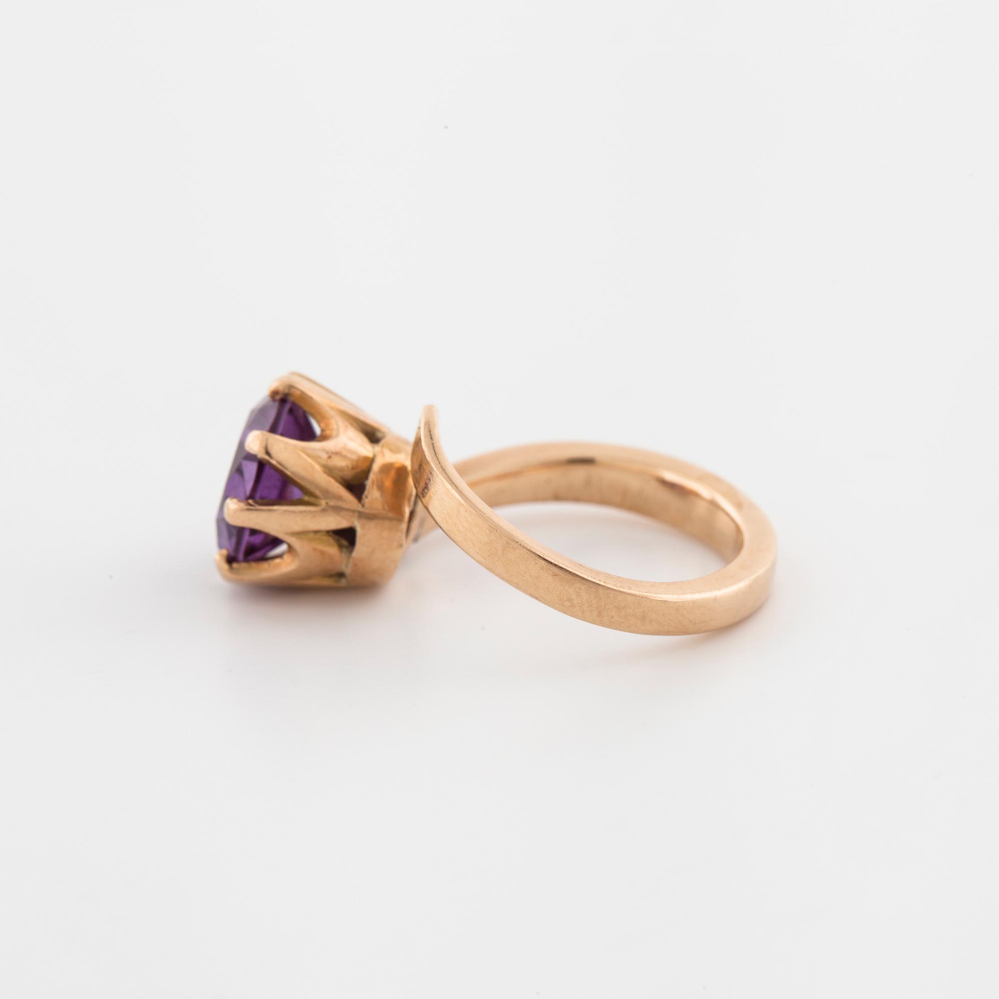 A synthetic color change sapphire ring.