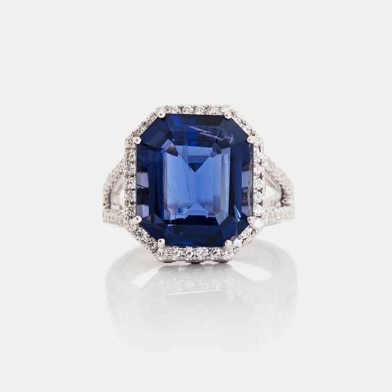 An iolite, 8.44 cts, and brilliant-cut, 1.11 cts in total, diamond ring.