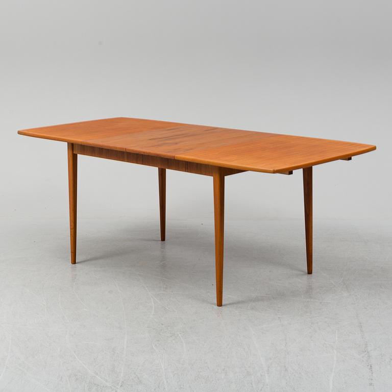 A second half of the 20th century teak veneered dining table.
