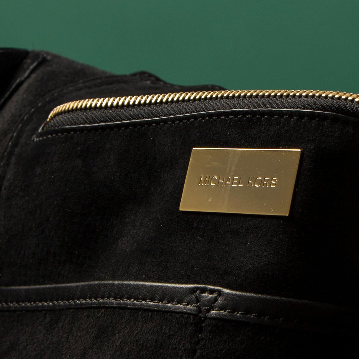 A hand bag by Michel Kors.