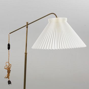 A mid 20th century floor lamp with a Le Klint shade.