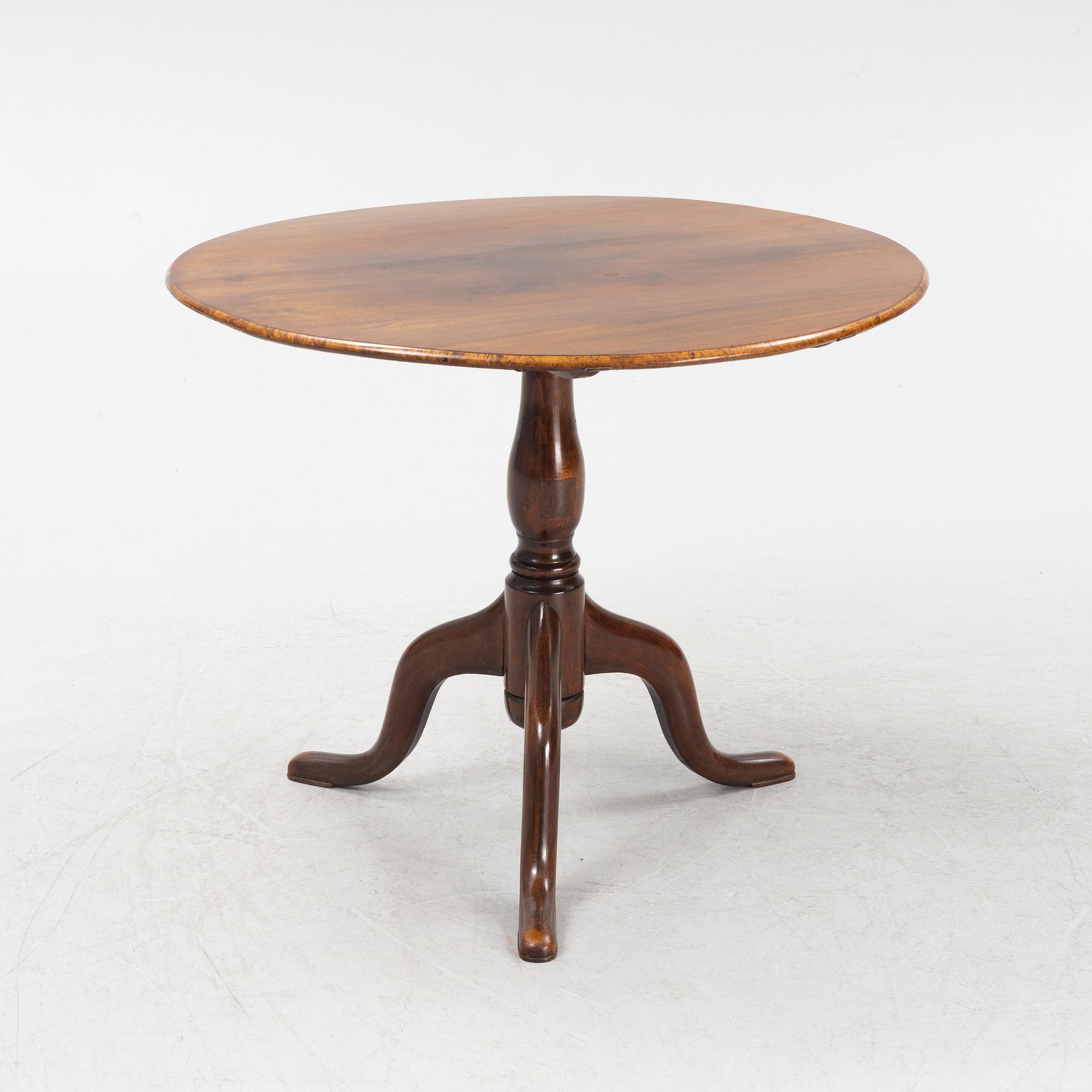 A tilt-top table.