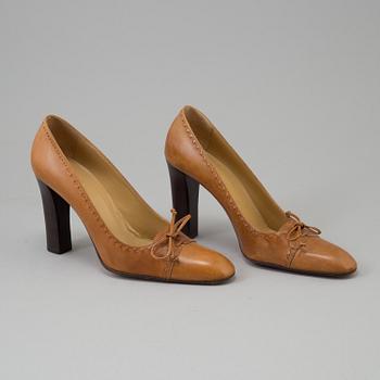 A pair of pumps by Gucci.