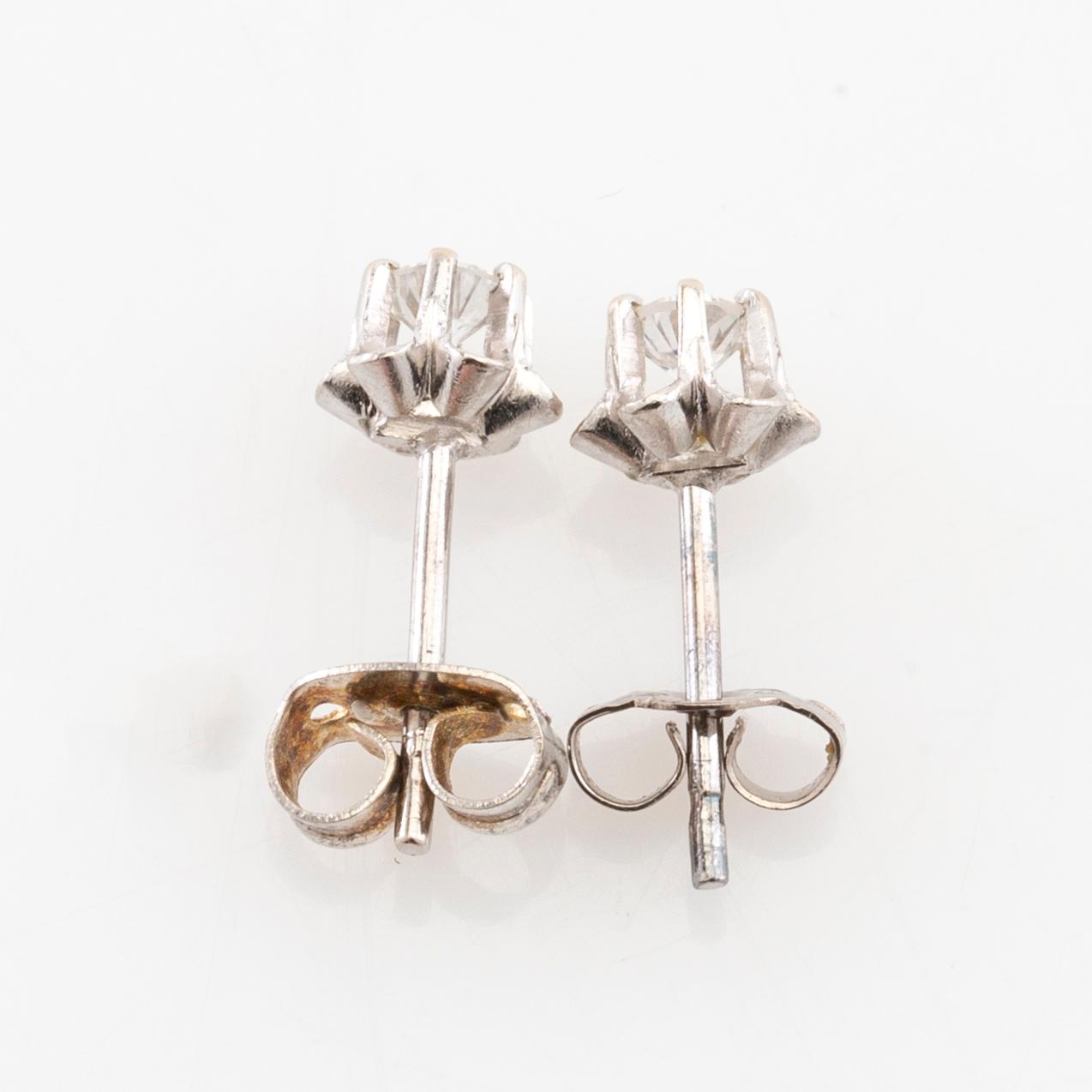 Earrings, a pair of 18K white gold set with round brilliant-cut diamonds.