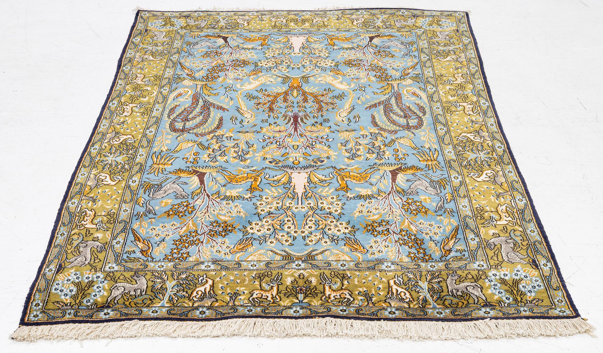 A Ghom figural rug, c. 202 x 132 cm.