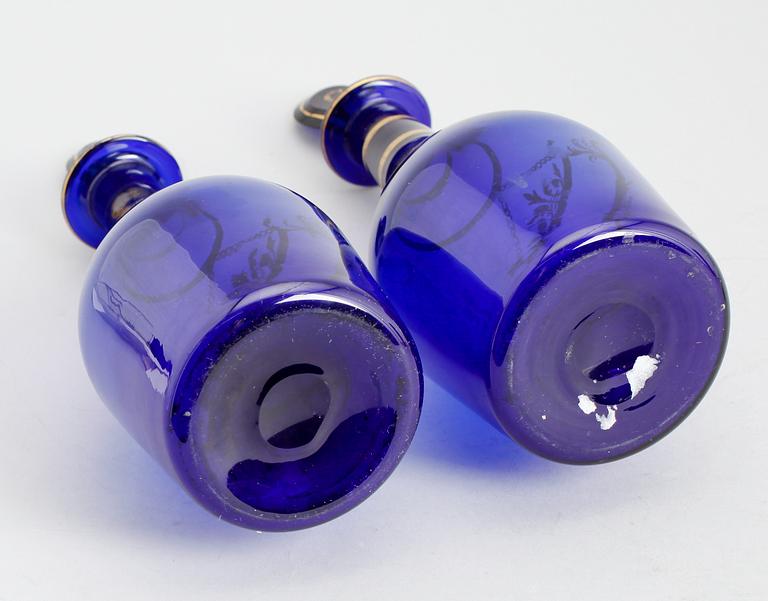 A pair of Bristol blue glass decanters and stoppers. Probably early 19th century.