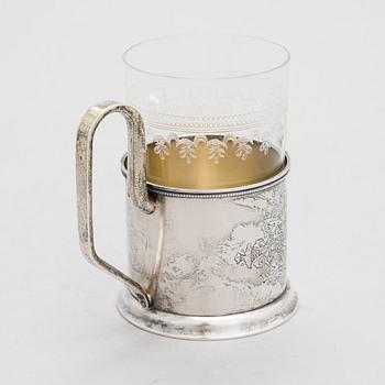 A Russian silver tea glass holder and a tea spoon, Moscow, Alexander Fuld 1889 and Antip Kuzmichev 1888. Glass, Finland.