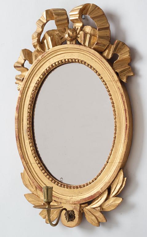 A pair of Gustavian late 18th century one-light girandole mirrors.