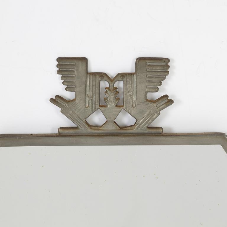 A Swedish pewter mirror, 1934.