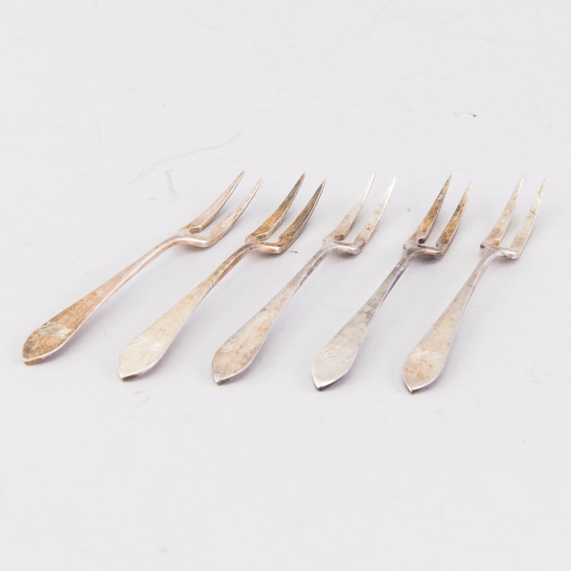 A 21-piece set of Finnish silver cutlery by Wilhelm Pettersson, Turku 1908-15.