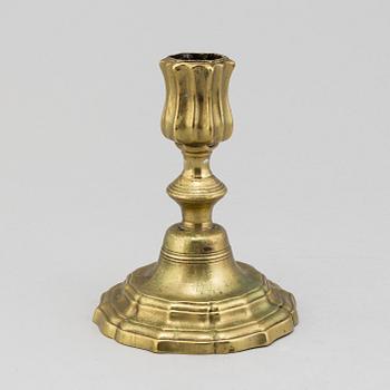 An 18th century rococo argent haché candlestick.