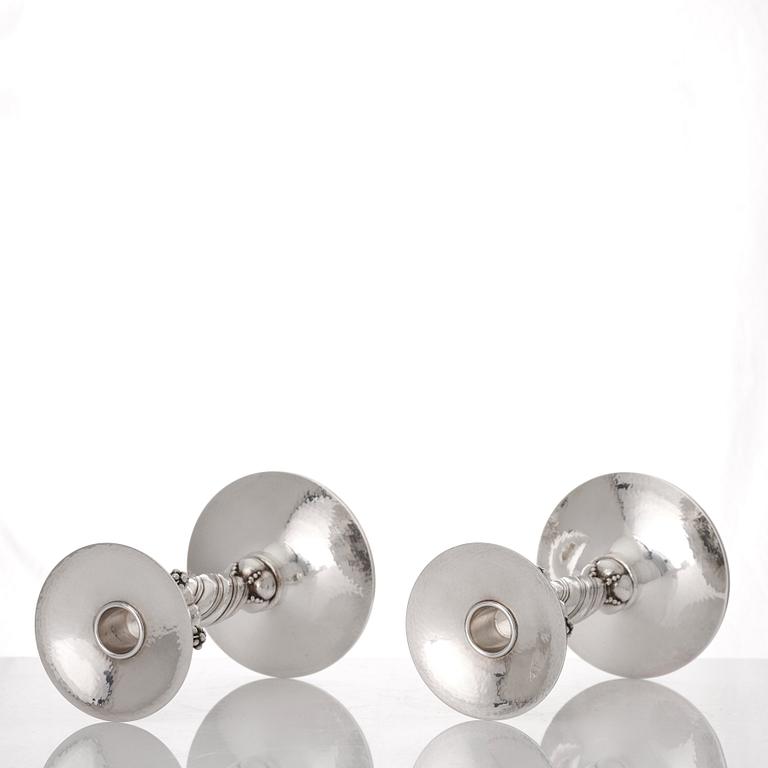 Georg Jensen, a pair of sterling silver grape decorated candlesticks, Copenhagen 1996, design nr 263B.