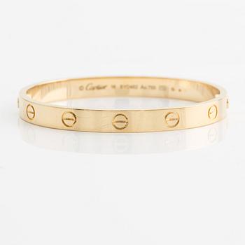 An 18K gold Cartier bracelet "Love".