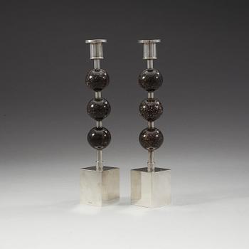 Sigurd Persson, a pair of silver plated and porphyry candlesticks, Sweden.