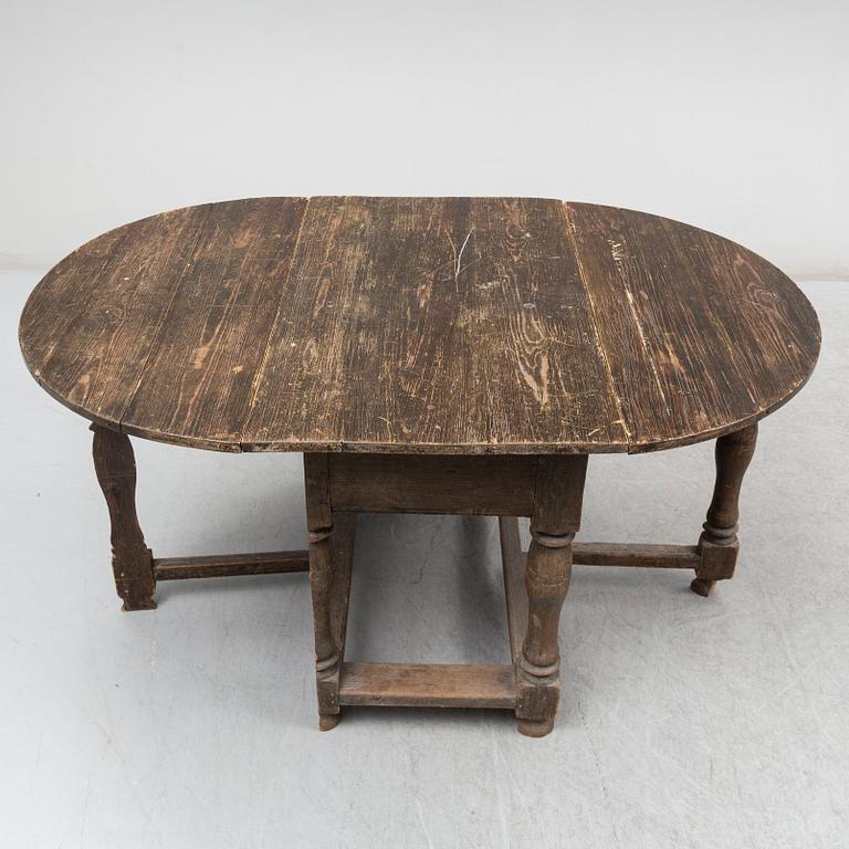 A Baroque-style gate leg table, 19th century.