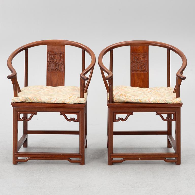 A pair of hardwood 'horse shoe back' hardwood armchairs, Hong Kong, 1960s.