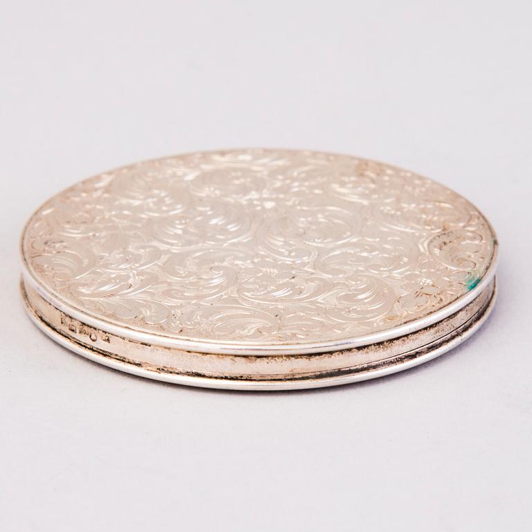 Two silver evening bags and a silver mirror, 1920s-1940s.