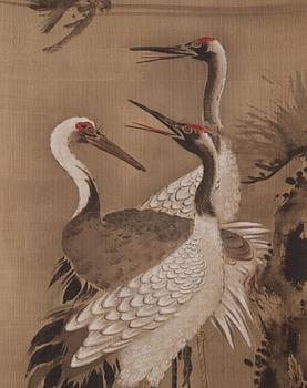 A scroll painting with cranes, signed Tsunenobu.