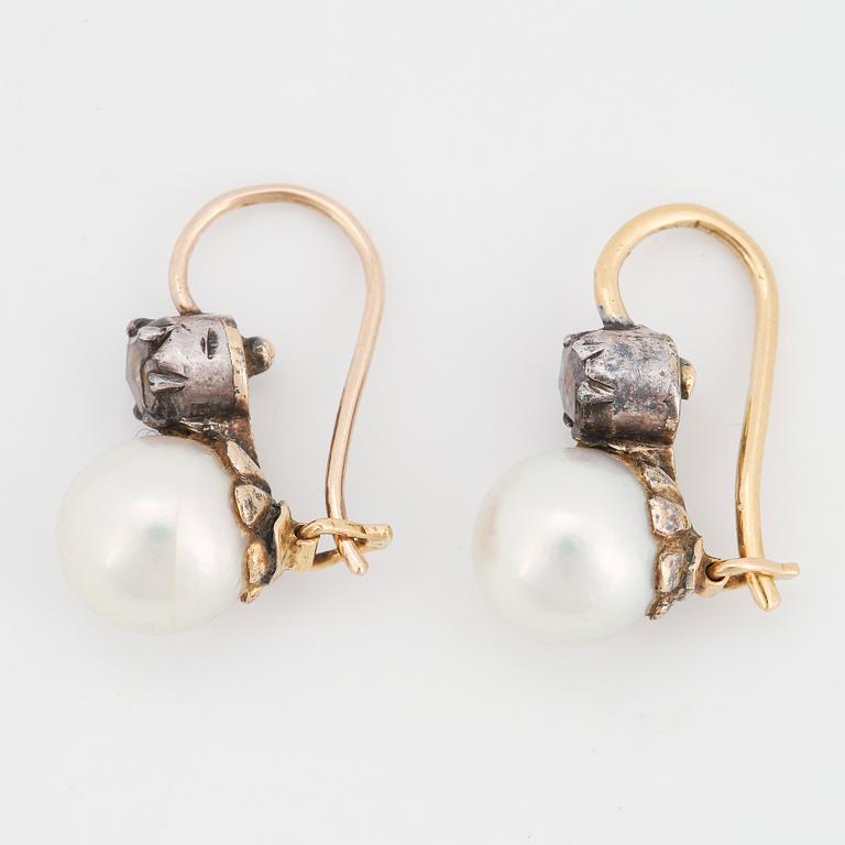 A pair of pearl and rose-cut diamond earrings.