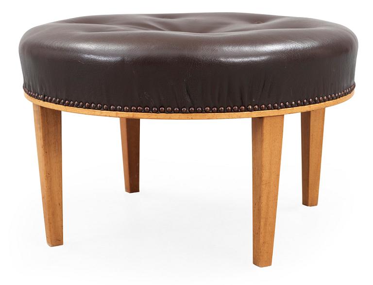 A Josef Frank mahogany and brown leather stool by Svenskt Tenn.