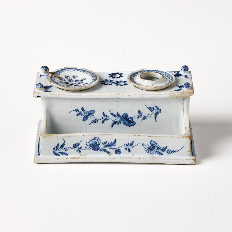 A Swedish Rörstrand faience desk set, dated Stockholm 22/11 1745.