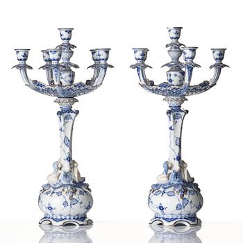 A pair of Royal Copenhagen 'Musselmalet' / 'blue fluted full lace' six-light candelabras, Denmark, 1898-1923.