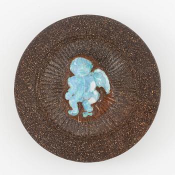 Carved boulder opal with a motif of a putto, possibly a paperweight.