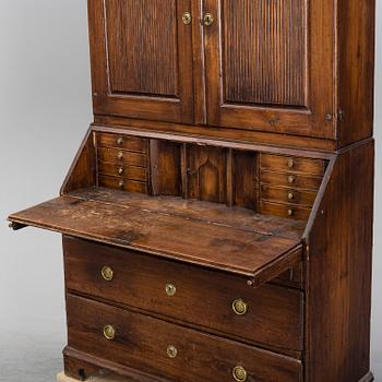 An early 19th Century pine cabinet.