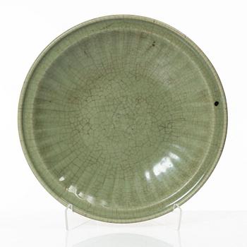 A large celadon glazed dish, Ming dynasty (1368-1644).