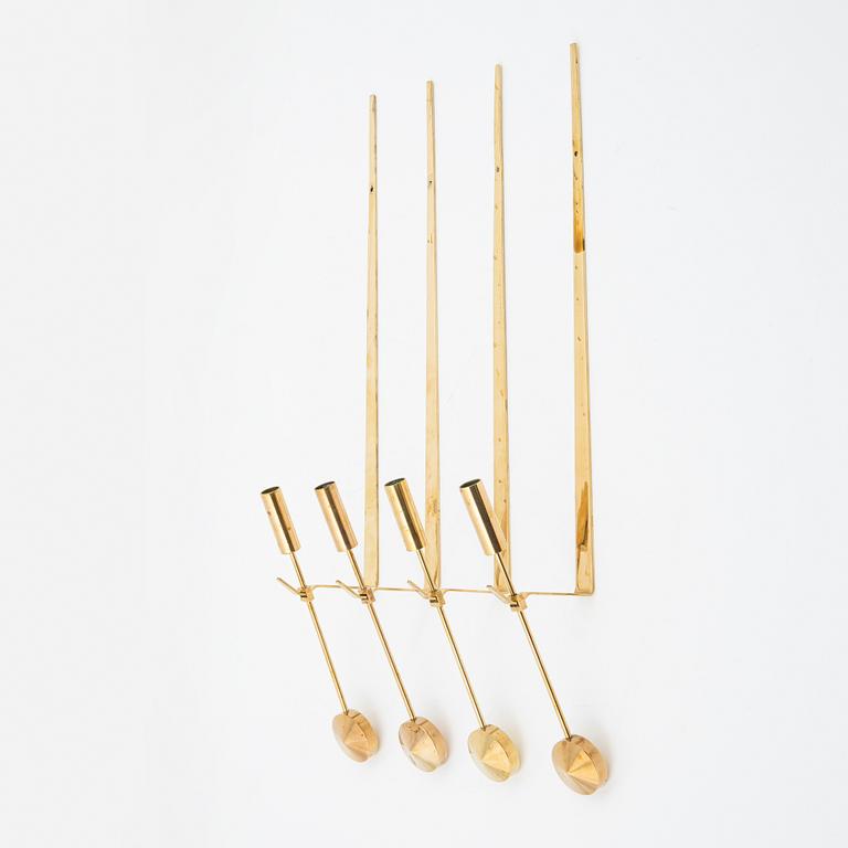 Pierre Forssell, a set of four brass 'Pendeln' wall lights from Skultuna, late 20th Century.