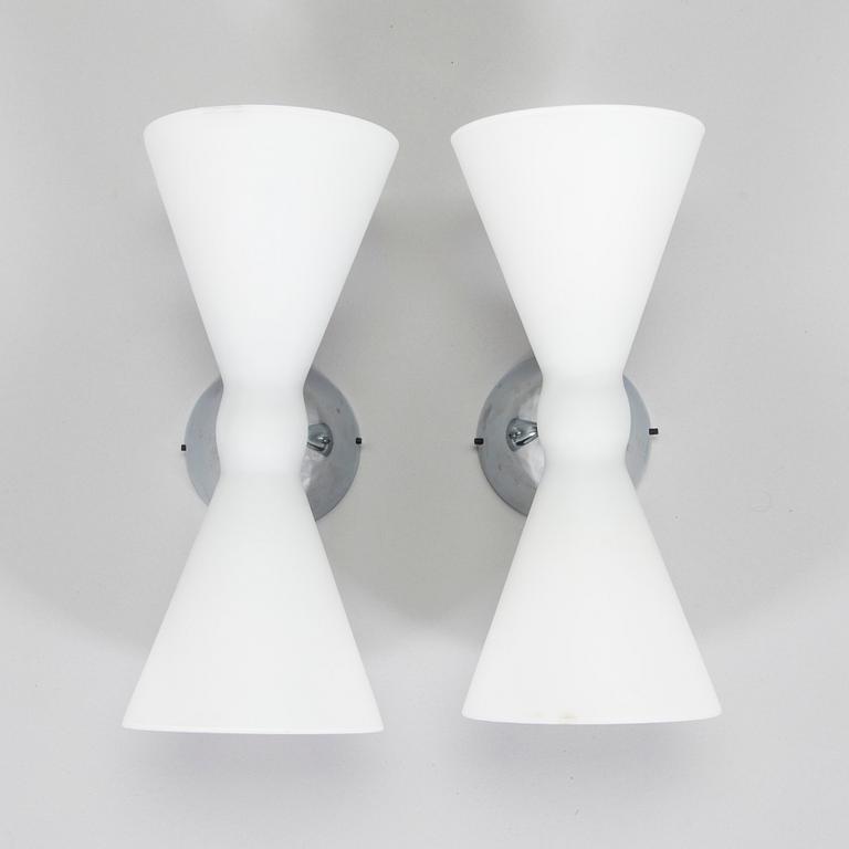 A pair of early 2000s wall lamps.