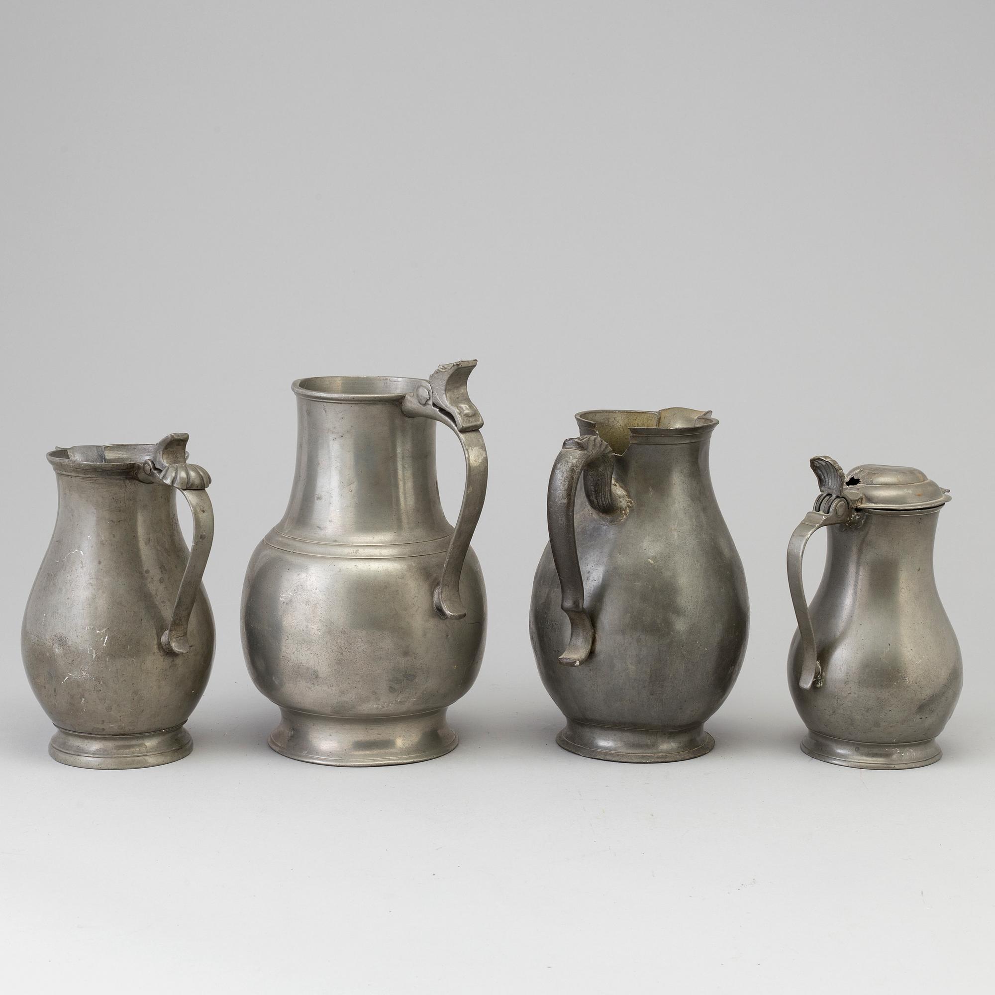 Four 18th century pewter jugs.