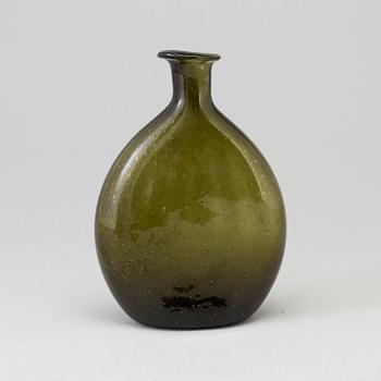 A 18th century glass bottle.