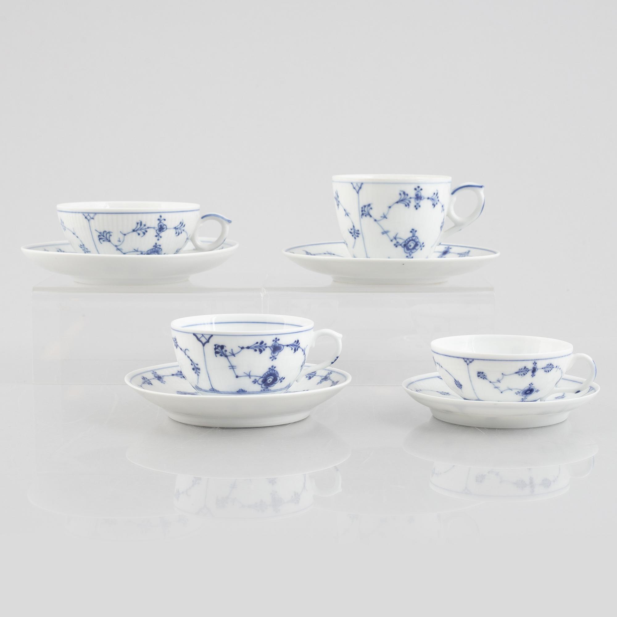 A group of four 'Blue Fluted' / 'Musselmalet rifflet' cups with saucers, Royal Copenhagen, 19th century and later.