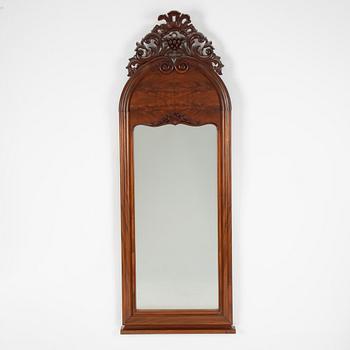 A Rococo revival mirror, late 19th Century.