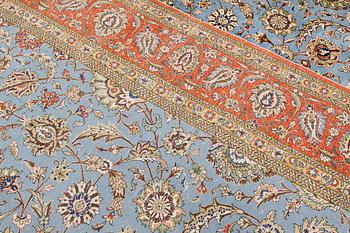 A Ghom carpet, part silk, approx. 480 x 350 cm.