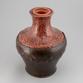 A large earthenware and copper vase, easy 20th century.