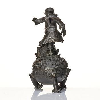 A bronze censer and cover in the shape of  Liu Haichan on the three legged toad, Qing dynasty.