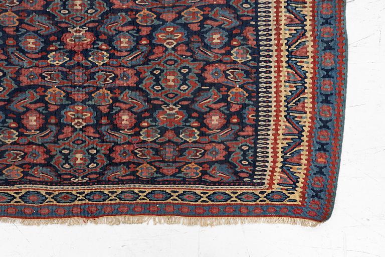 An antique Senneh kilim, West Persia, c. 149 x 11 cm.