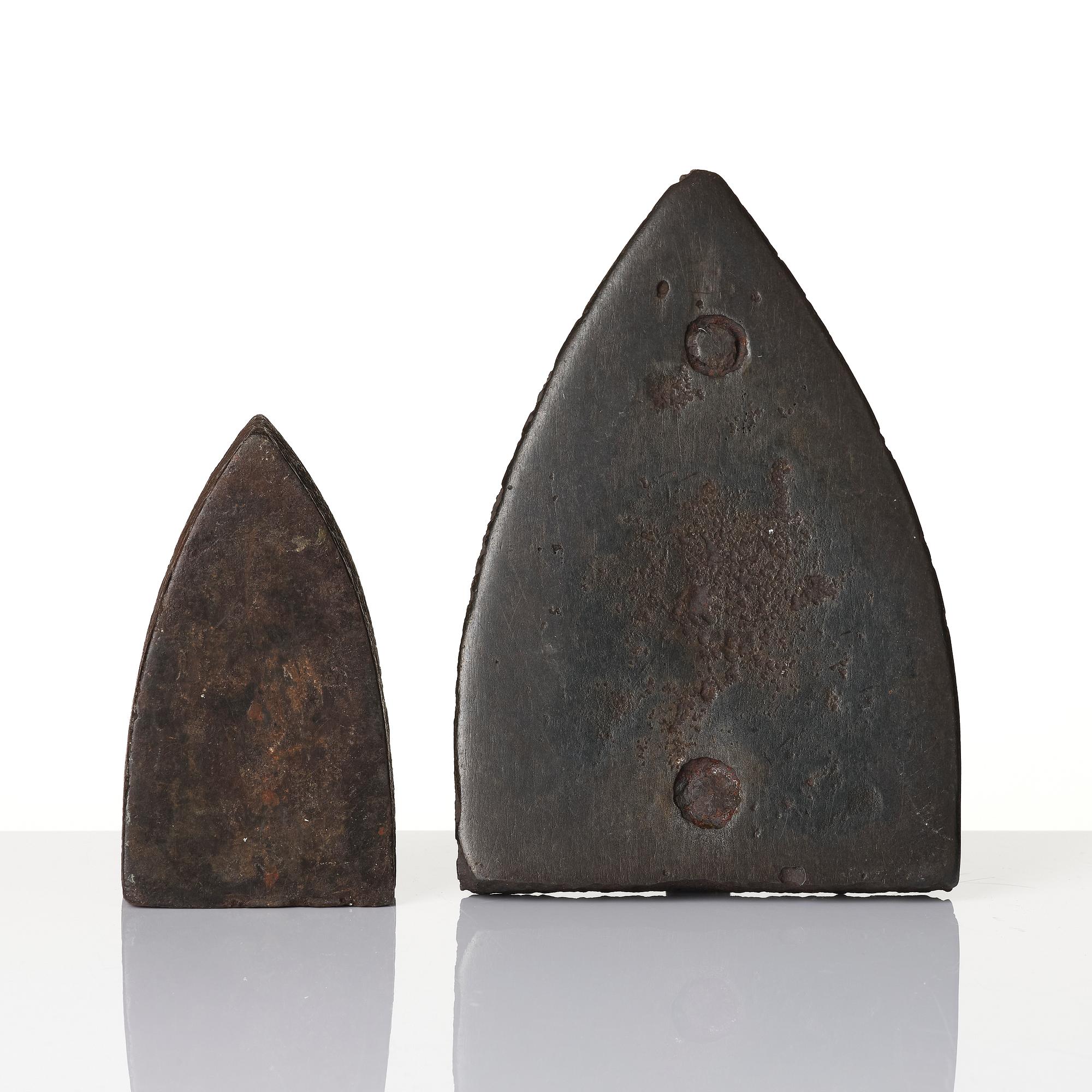 Two cast iron clothes irons, 18th / early 19th century.