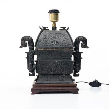 A Chinese bronze table lamp, later part of the 20th century.