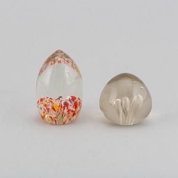 A group of 12 glass paper weights.
