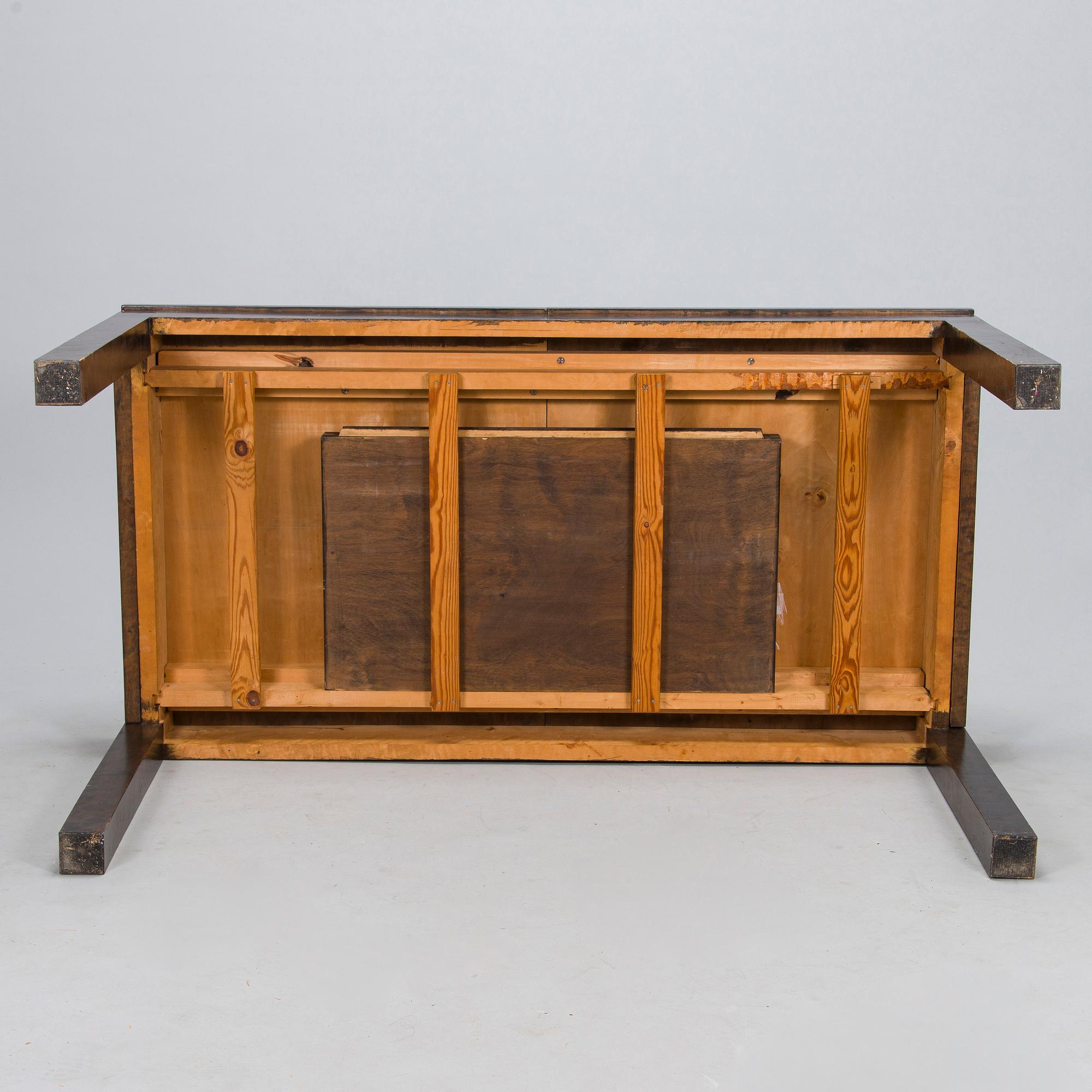 A Finnish 1930s dining table and eight chairs.