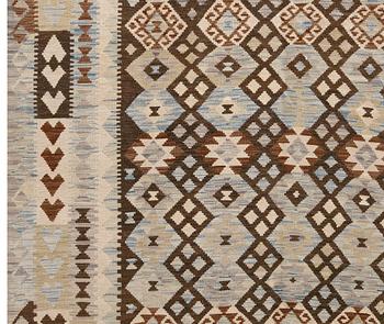 A kilim rug, c 398 x 302 cm.