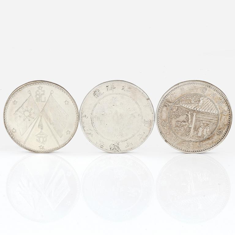 A group of three Chinese silver coins, Guangxu (1908), and two from the Republic era (1912-1949).
