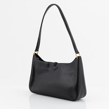 Longchamp, a leather bag.