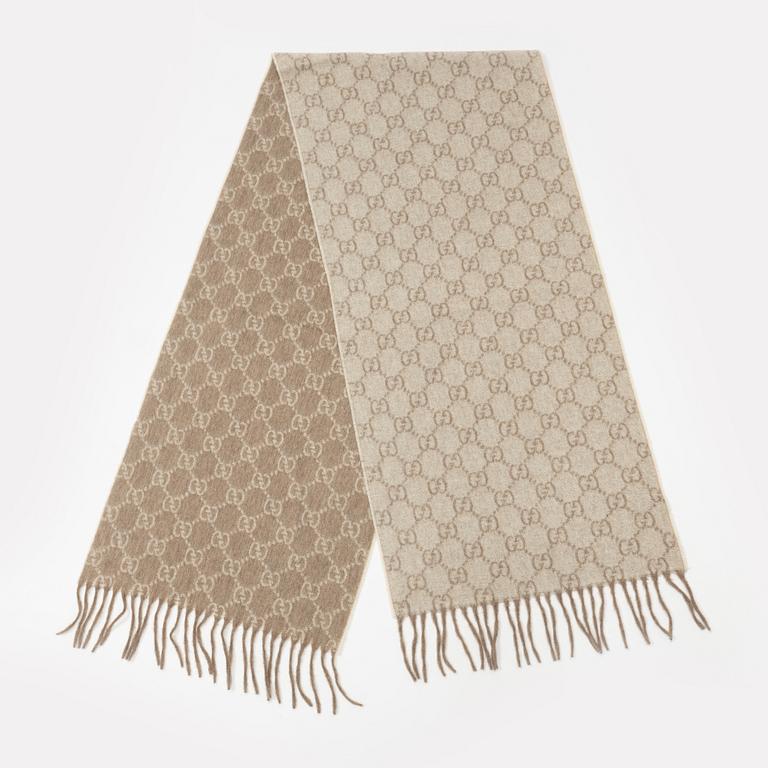 Gucci, a monogram cashmere scarf.