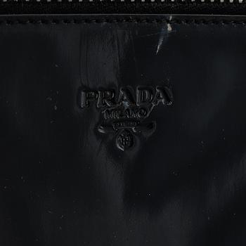 Prada, a patent leather bag.