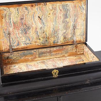 A South-German Baroque ebonized collector's cabinet on stand, circa 1700.