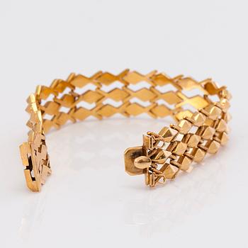 A 14K gold bracelet.